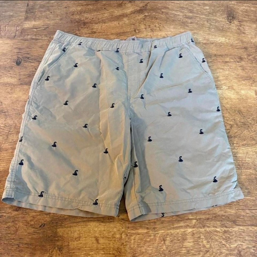 Tan shorts with snake embroidery all over print